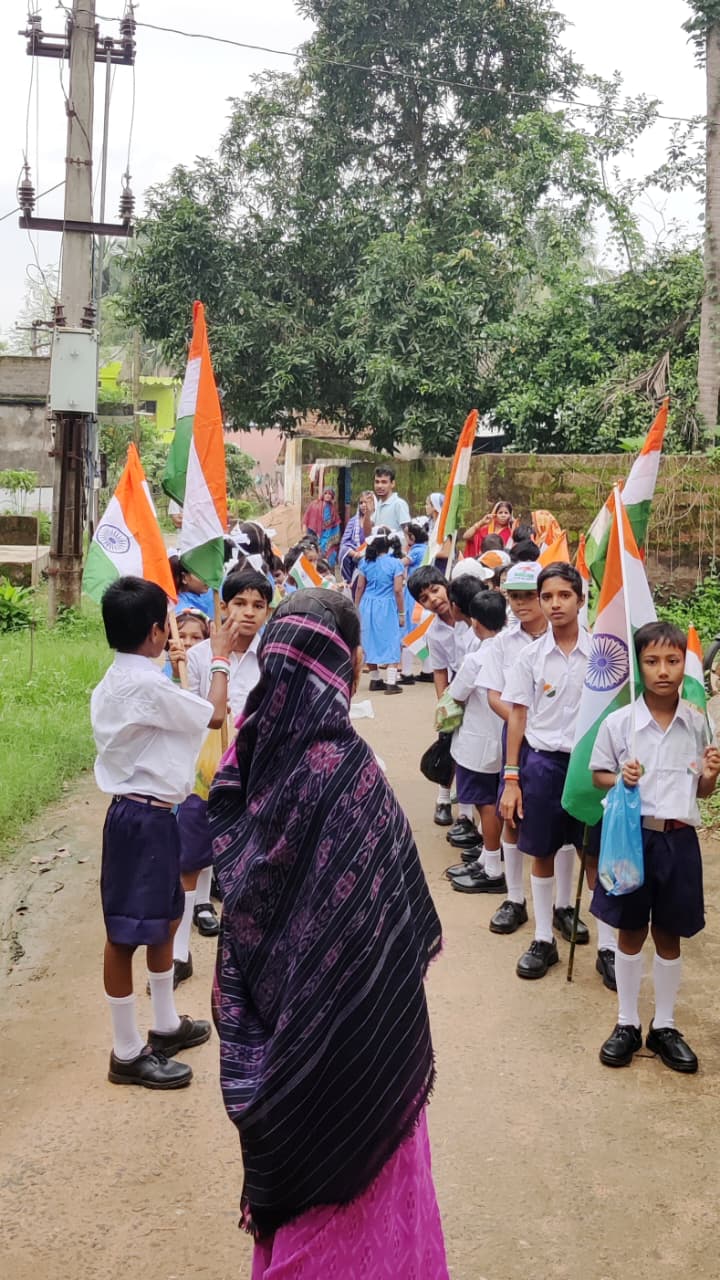 School students participating in Kendupalli village Independence Day parade